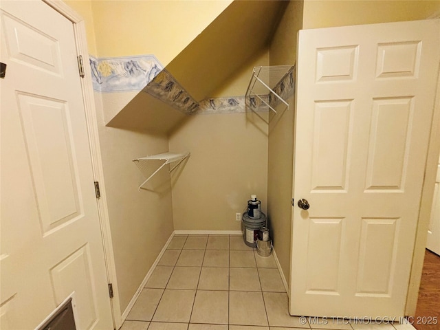 spacious closet featuring light tile patterned floors