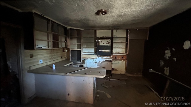 unfurnished office featuring a textured ceiling