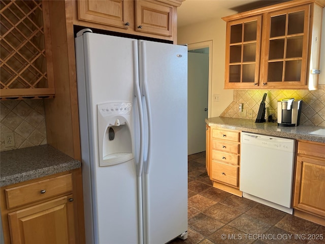 kitchen with white appliances and backsplash