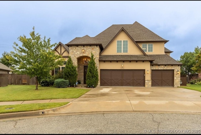 view of front of property with a garage and a front yard