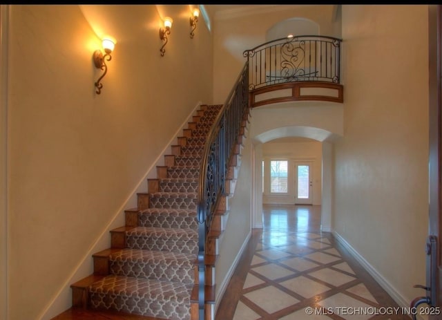 stairway featuring tile patterned floors