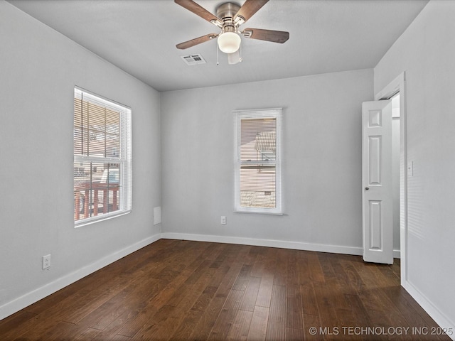 unfurnished room featuring ceiling fan and dark hardwood / wood-style floors