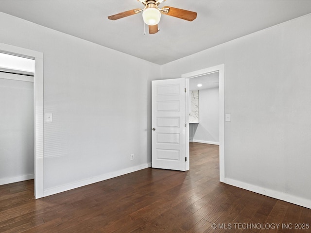 unfurnished bedroom with dark hardwood / wood-style floors, a closet, and ceiling fan