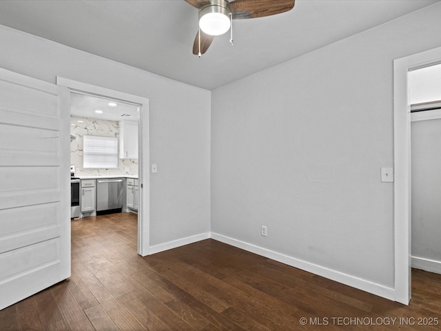 unfurnished bedroom with dark hardwood / wood-style flooring and ceiling fan