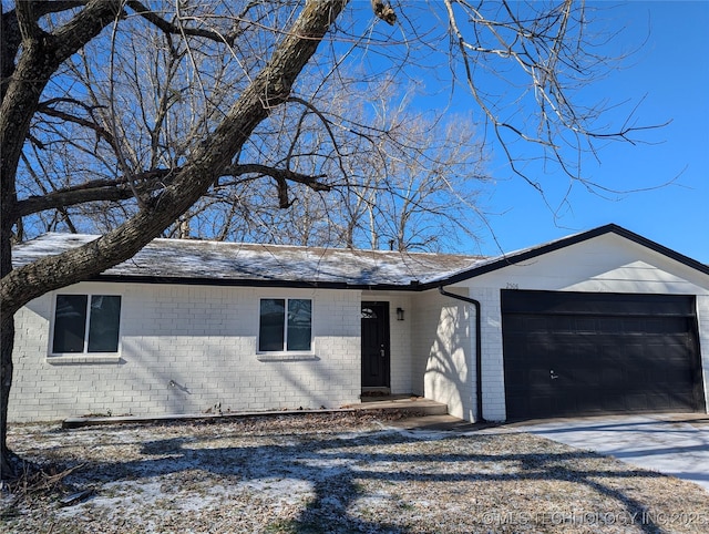 single story home featuring a garage