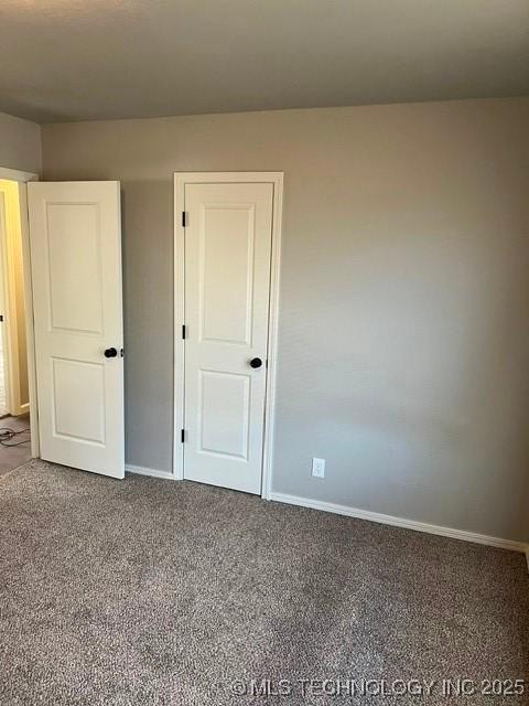 unfurnished bedroom featuring carpet flooring