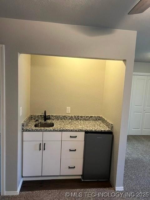 bathroom featuring vanity and a textured ceiling