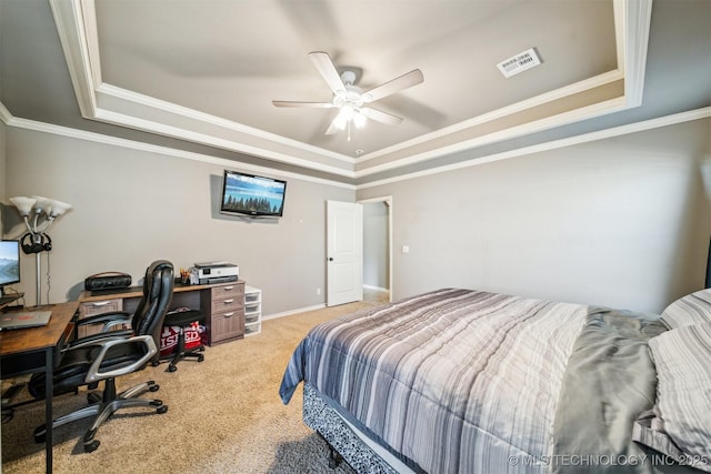 bedroom featuring carpet floors, a raised ceiling, and ceiling fan