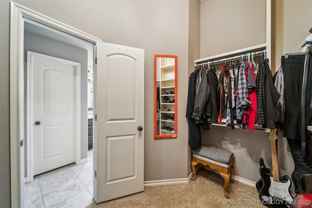 spacious closet with light tile patterned flooring