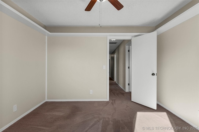 spare room with ceiling fan, carpet flooring, and a textured ceiling