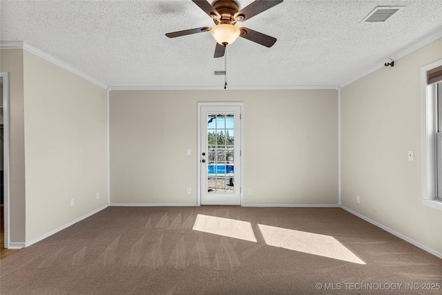 carpeted spare room featuring ceiling fan, crown molding, and a textured ceiling