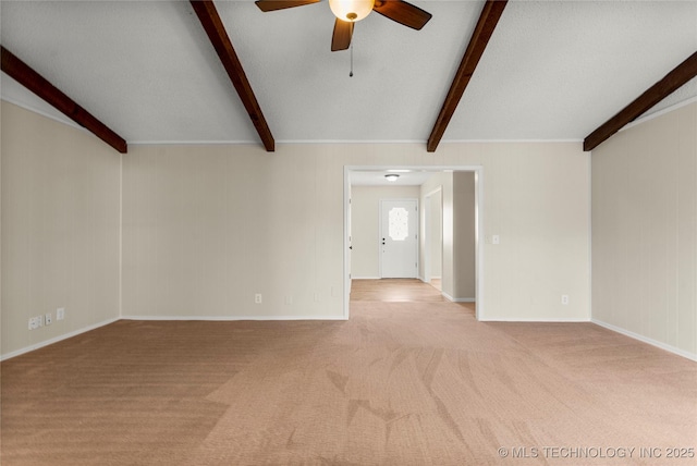 unfurnished living room with ceiling fan, light colored carpet, and beam ceiling