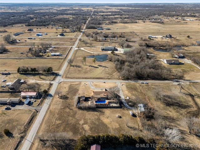 birds eye view of property with a rural view