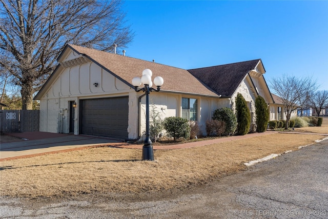 view of side of home featuring a garage