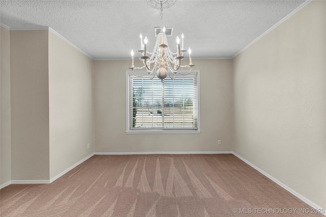 spare room featuring crown molding, carpet floors, a textured ceiling, and a chandelier