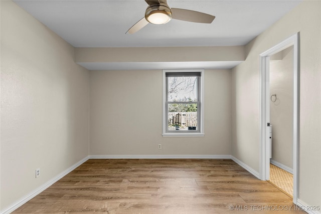 empty room featuring ceiling fan and light wood-type flooring