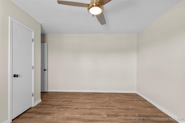 unfurnished room with ceiling fan and light hardwood / wood-style flooring