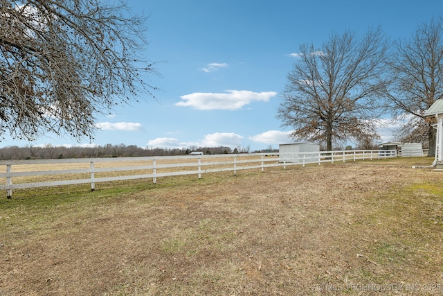 view of yard with a rural view