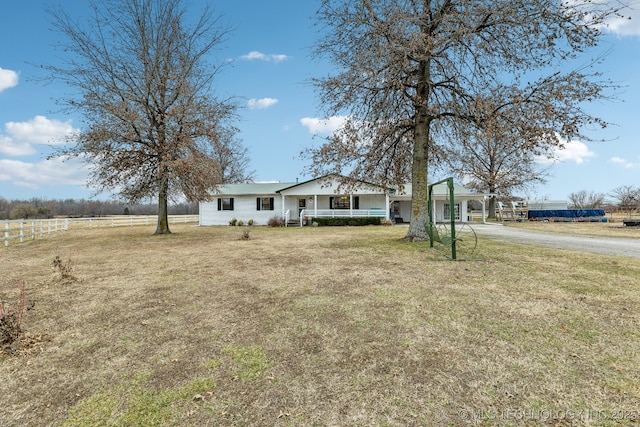 view of front facade with a porch and a front lawn