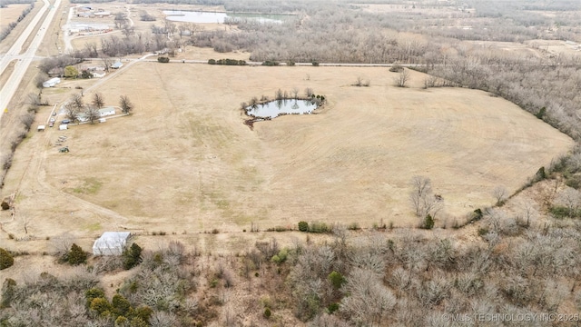 birds eye view of property with a rural view