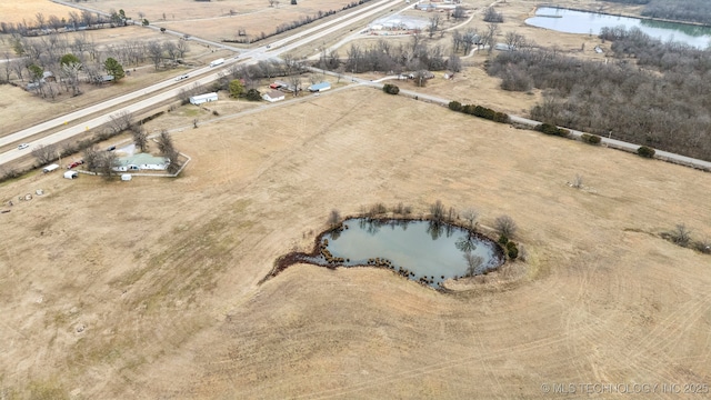 aerial view featuring a water view and a rural view