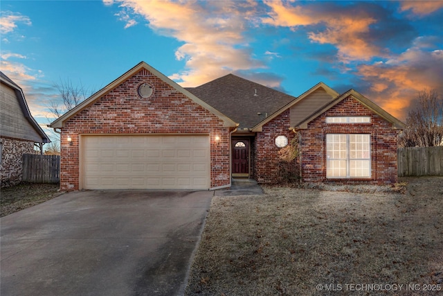 front of property with a garage