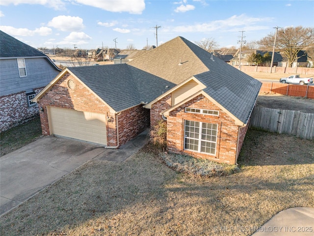 front of property featuring a garage and a front lawn