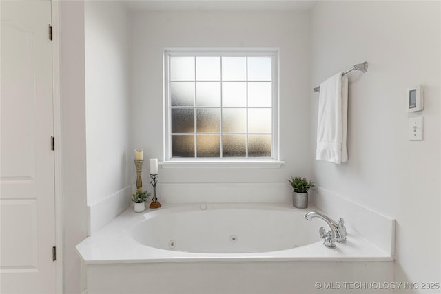 bathroom featuring a bath