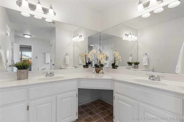 bathroom featuring vanity and tile patterned flooring