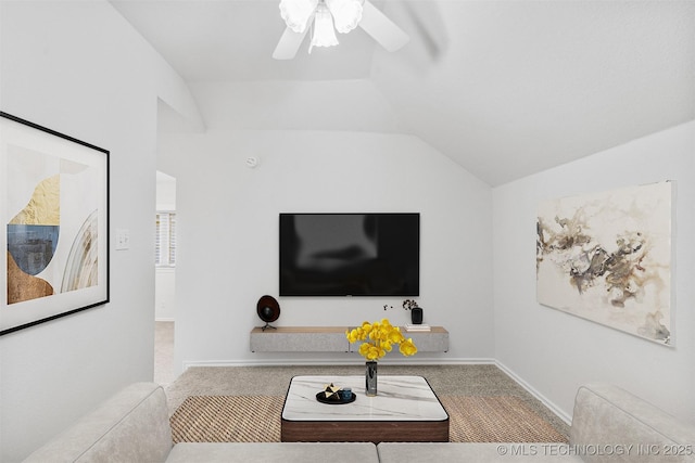 living room with vaulted ceiling, carpet, and ceiling fan