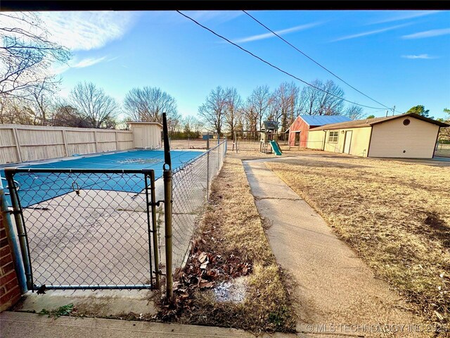 view of pool with a playground