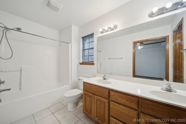 full bathroom featuring tile patterned flooring, vanity, toilet, and washtub / shower combination