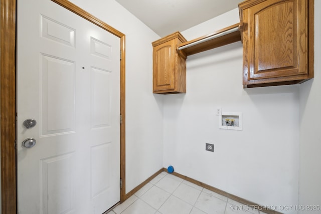 laundry room with cabinets, hookup for an electric dryer, hookup for a washing machine, and light tile patterned floors