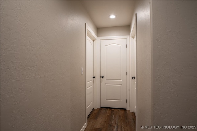 hall with dark wood-type flooring