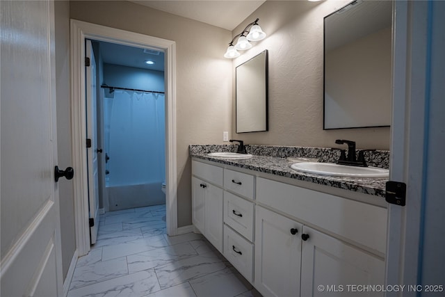 full bathroom featuring vanity, toilet, and shower / tub combo