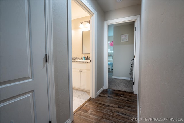 hall with dark wood-type flooring