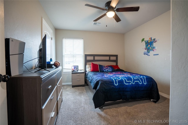 bedroom featuring light carpet and ceiling fan