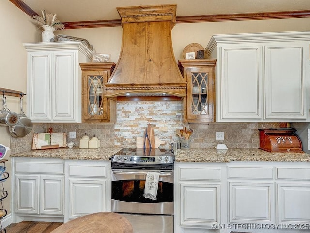 kitchen with white cabinetry, backsplash, custom exhaust hood, and stainless steel range with electric cooktop