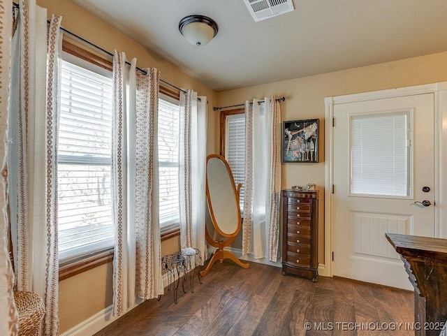 interior space with dark hardwood / wood-style floors