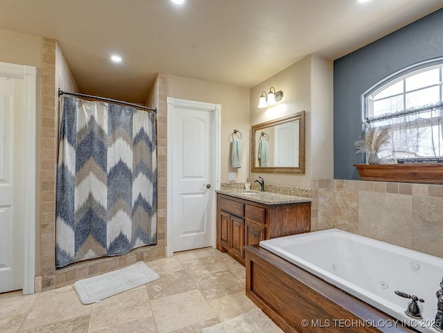 bathroom featuring independent shower and bath and vanity