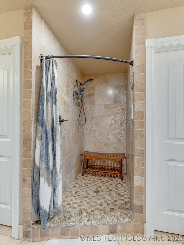 bathroom featuring a shower with curtain