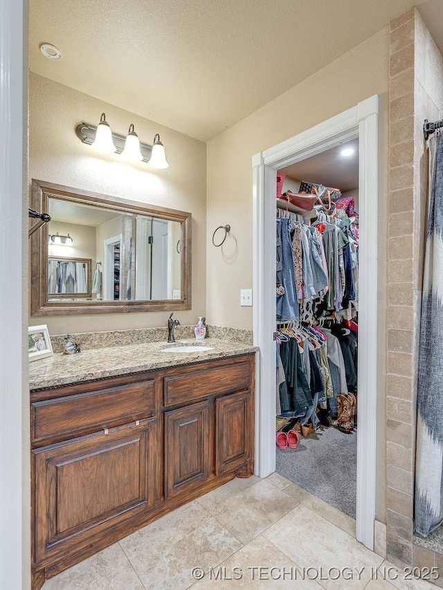 bathroom featuring vanity and tile patterned flooring