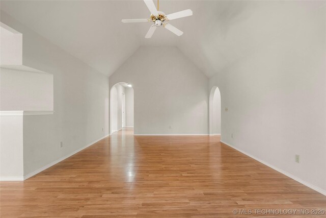 unfurnished living room featuring high vaulted ceiling, ceiling fan, and light hardwood / wood-style floors