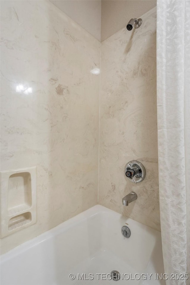 bathroom featuring shower / tub combo with curtain