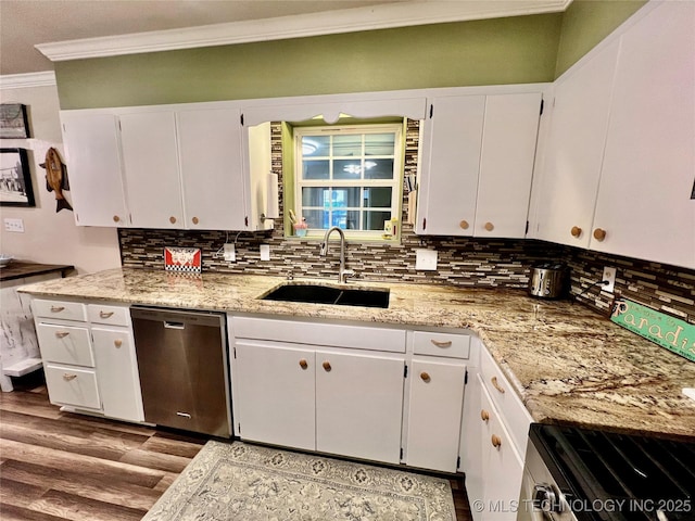 kitchen featuring white cabinetry, sink, tasteful backsplash, and stainless steel appliances