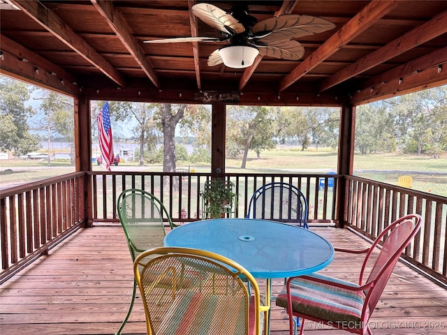 wooden terrace featuring ceiling fan