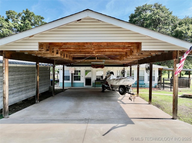 view of parking / parking lot with a carport