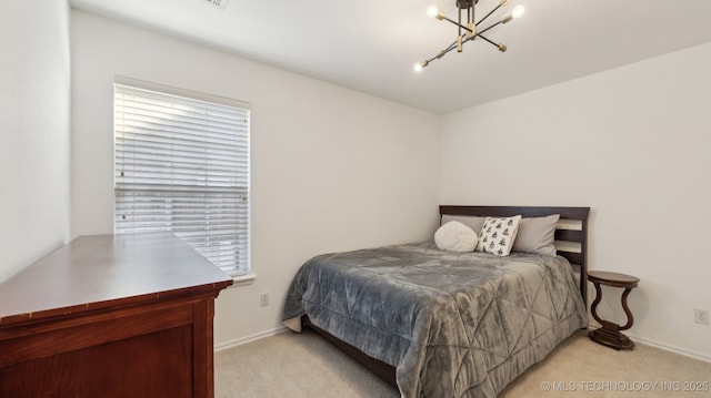 carpeted bedroom with multiple windows and a notable chandelier