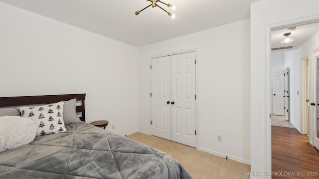 bedroom with carpet floors and a closet