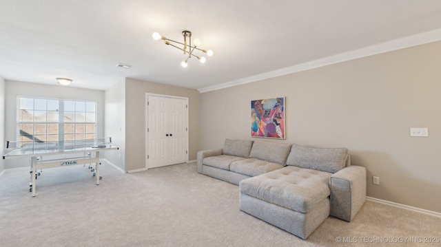 carpeted living room featuring an inviting chandelier